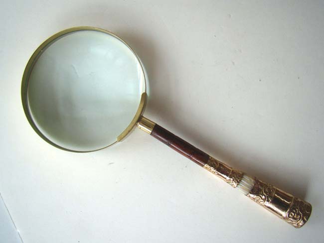 A late Victorian Magnifying Glass with engaved gilt and mother-of-pearl handle circa 1900